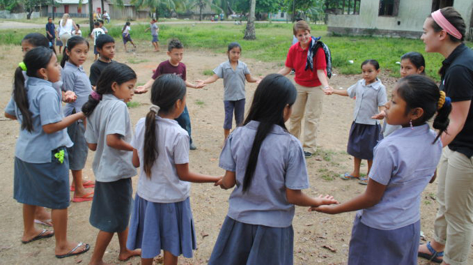 ISLP participants work with students during a previous ISLP trip.