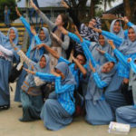 UofL alum and Fulbright Scholar Shelby Lawson, center, has some fun with new friends in Indonesia.