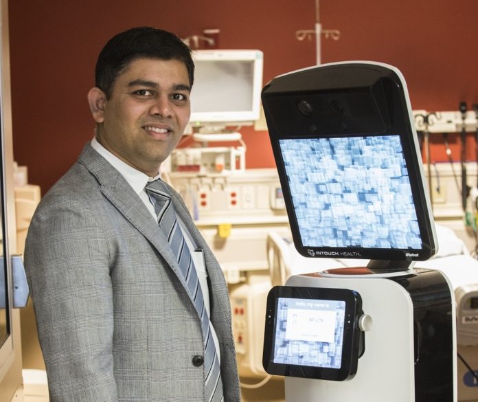 UofL tele-stroke consultation robot with Jignesh Shah, M.D., of the UofL Stroke Program UofL tele-stroke consultation robot with Jignesh Shah, M.D., of the UofL Stroke Program
