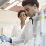 LaCreis Kidd, Ph.D., with Cancer Education Program participant Thomas Packer, Jr.