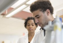 LaCreis Kidd, Ph.D., with Cancer Education Program participant Thomas Packer, Jr.