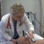 At the sim lab, med students learn on interactive, human-like robots and real people posing as patients.