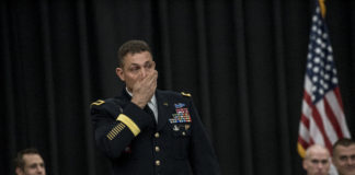 Brig. Gen. Brian J. Mennes composes himself as he begins his keynote speech to graduating cadets, family members and friends at the Army ROTC's Spring 2017 commissioning ceremony. Mennes said as he sat on the airplane to travel to Louisville, several people thanked him for his service, and he felt humbled.