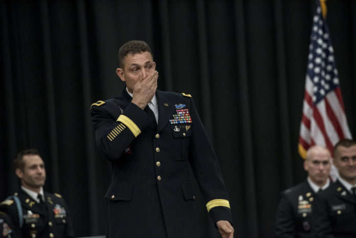 Brig. Gen. Brian J. Mennes composes himself as he begins his keynote speech to graduating cadets, family members and friends at the Army ROTC's Spring 2017 commissioning ceremony. Mennes said as he sat on the airplane to travel to Louisville, several people thanked him for his service, and he felt humbled.