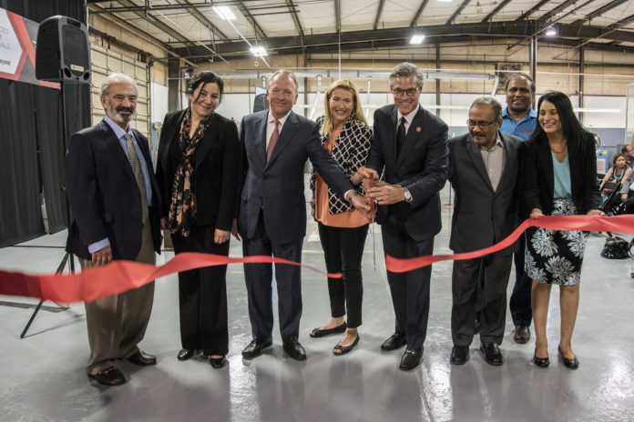 AME ribbon cutting Advanced Energy Materials LLC has roots at UofL, and was born from a break-through technology developed at the Conn Center for Renewable Energy Research.