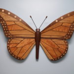 Associate biology professor Steve Yanoviak’s wood sculpture, titled “Claire’s Monarch,” spans 34-by-25 inches and is handcrafted using Kentucky hardwoods