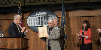 Louisville Mayor Greg Fischer awarded UofL's Justin Mog the city’s Joan Riehm Memorial Environmental Leadership Award.