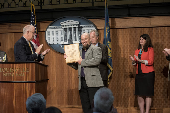 Louisville Mayor Greg Fischer awarded UofL's Justin Mog the city’s Joan Riehm Memorial Environmental Leadership Award.