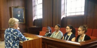 Professor Rothstein speaks with the high school students in the Allen Courtroom. Left to right, they are: Gabrielle Alston, Mahagoni Richardson, Makayla Rankin and Sierra Daniels.