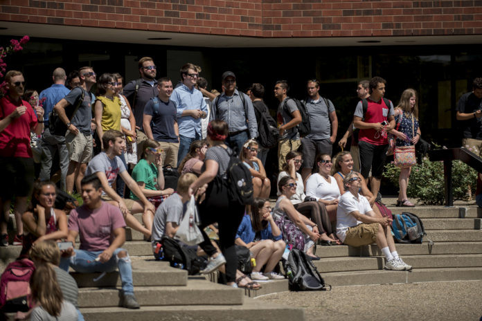 Large pockets of people gathered all over campus Monday to witness the solar eclipse.