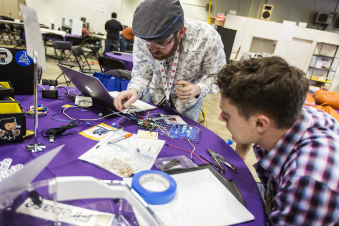 Participants in FirstBuild's 2015 MegaHackathon work on their project. FirstBuild, backed by GE Appliances, is a maker space and micro factory at the University of Louisville.