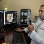 Bruno Azevedo, D.D.S., M.S., works with 3D digital data system