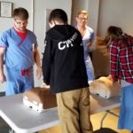 Students practice CPR at the Kentucky Science Center as part of Research!Louisville