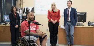 Andrew Meas, a research participant at UofL with a complete spinal cord injury, with members of the resarch team, Claudia Angeli, Susan Harkema and Enrico Rejc,.