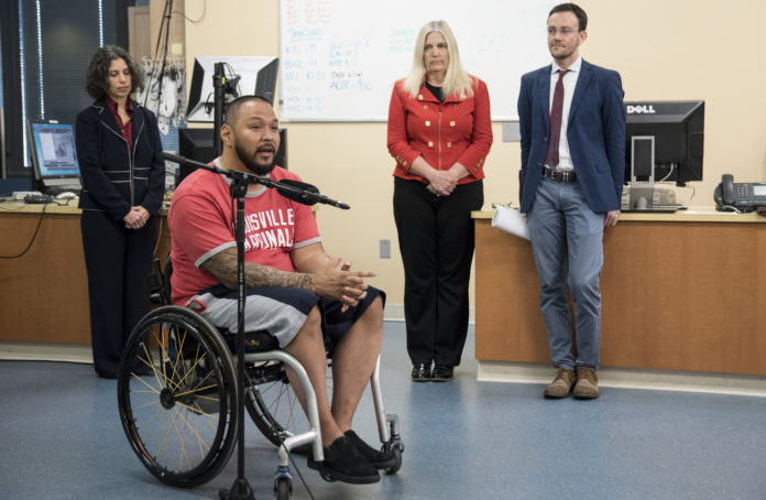 Andrew Meas, a research participant at UofL with a complete spinal cord injury, with members of the resarch team, Claudia Angeli, Susan Harkema and Enrico Rejc,.