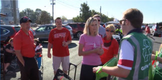 Gameday Green Teams of students walk around stadium parking lots before UofL football games, handing out green recycling bags to make it easier for fans to recycle their cans and paper products.