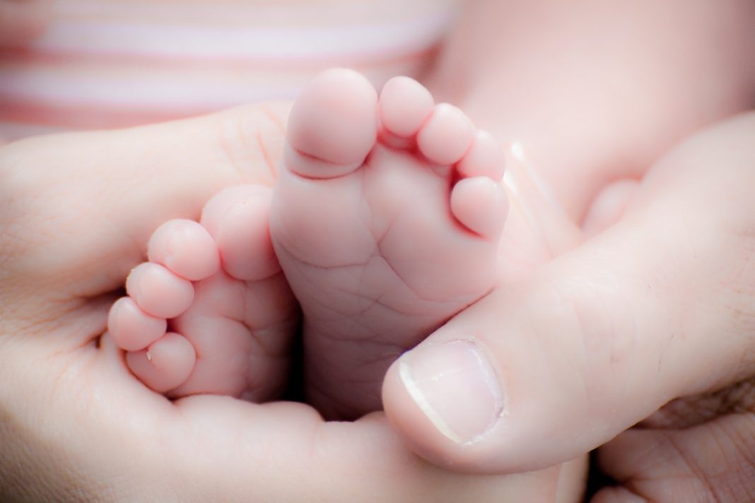Baby feet with hands