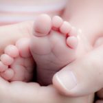 Baby feet with hands
