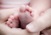 Baby feet with hands