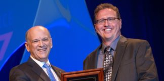 Kristopher K. Rau, Ph.D., receives the Next Generation award from Eric Nestler, M.D., Ph.D., 2016-17 president of the national Society for Neuroscience.