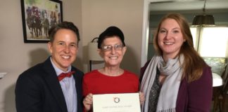 Julie Weber, center, receives this year's LGBT Ally Award from Lisa Gunterman (left) and Katy Garrison.