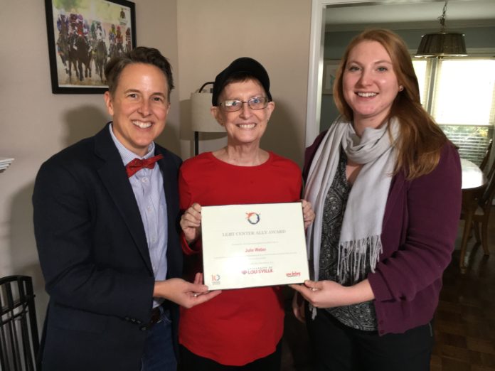 Julie Weber, center, receives this year's LGBT Ally Award from Lisa Gunterman (left) and Katy Garrison.