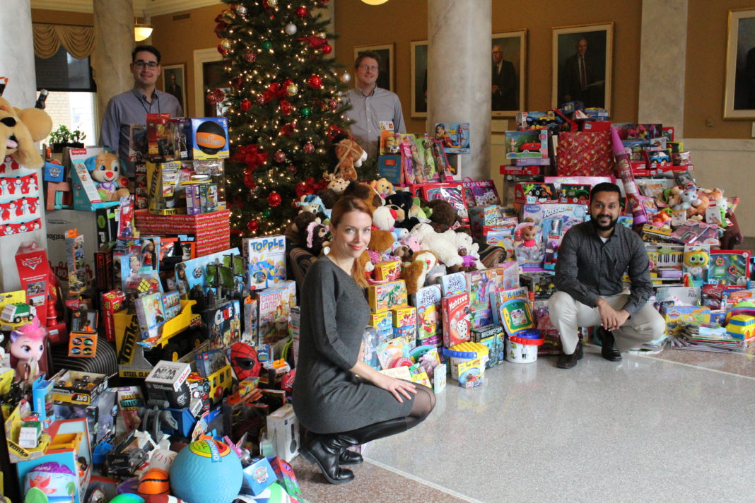 The UofL House Staff Council collected nearly 900 toys for its Toys for Tots campaign this month. Resident physicians pictured are, clockwise from lower left, Svetlana Famina, M.D., Jason Messinger, M.D., Jamie Morris, M.D. and Paul Parackal, M.B.B.S.