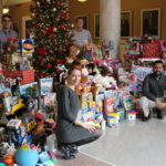 The UofL House Staff Council collected nearly 900 toys for its Toys for Tots campaign this month. Resident physicians pictured are, clockwise from lower left, Svetlana Famina, M.D., Jason Messinger, M.D., Jamie Morris, M.D. and Paul Parackal, M.B.B.S.
