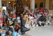 The UofL House Staff Council collected nearly 900 toys for its Toys for Tots campaign this month. Resident physicians pictured are, clockwise from lower left, Svetlana Famina, M.D., Jason Messinger, M.D., Jamie Morris, M.D. and Paul Parackal, M.B.B.S.