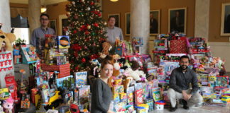 The UofL House Staff Council collected nearly 900 toys for its Toys for Tots campaign this month. Resident physicians pictured are, clockwise from lower left, Svetlana Famina, M.D., Jason Messinger, M.D., Jamie Morris, M.D. and Paul Parackal, M.B.B.S.