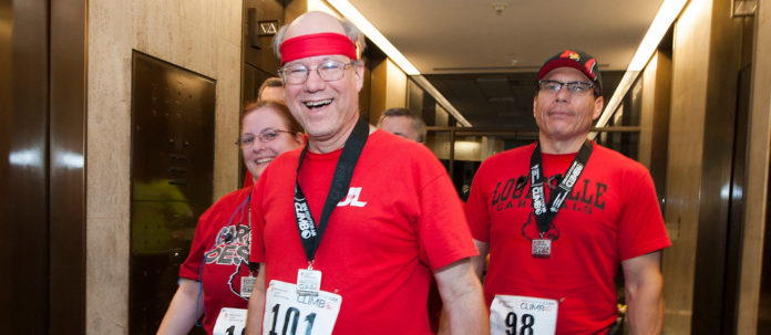 2016-02-06 SteveLisa&OscarBeforeClimb Steve Lindsey, a longtime UofL employee, will participate in the Fight for Air Climb Feb. 3 his third time participating since receiving a double-lung transplant.