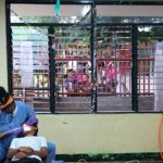 A resident of Cebu receives dental care from a UofL student in the School of Dentistry