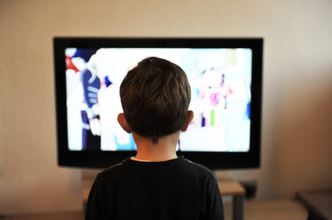 child watching television