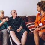 Older adults talking with a health care provider.