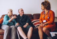 Older adults talking with a health care provider.