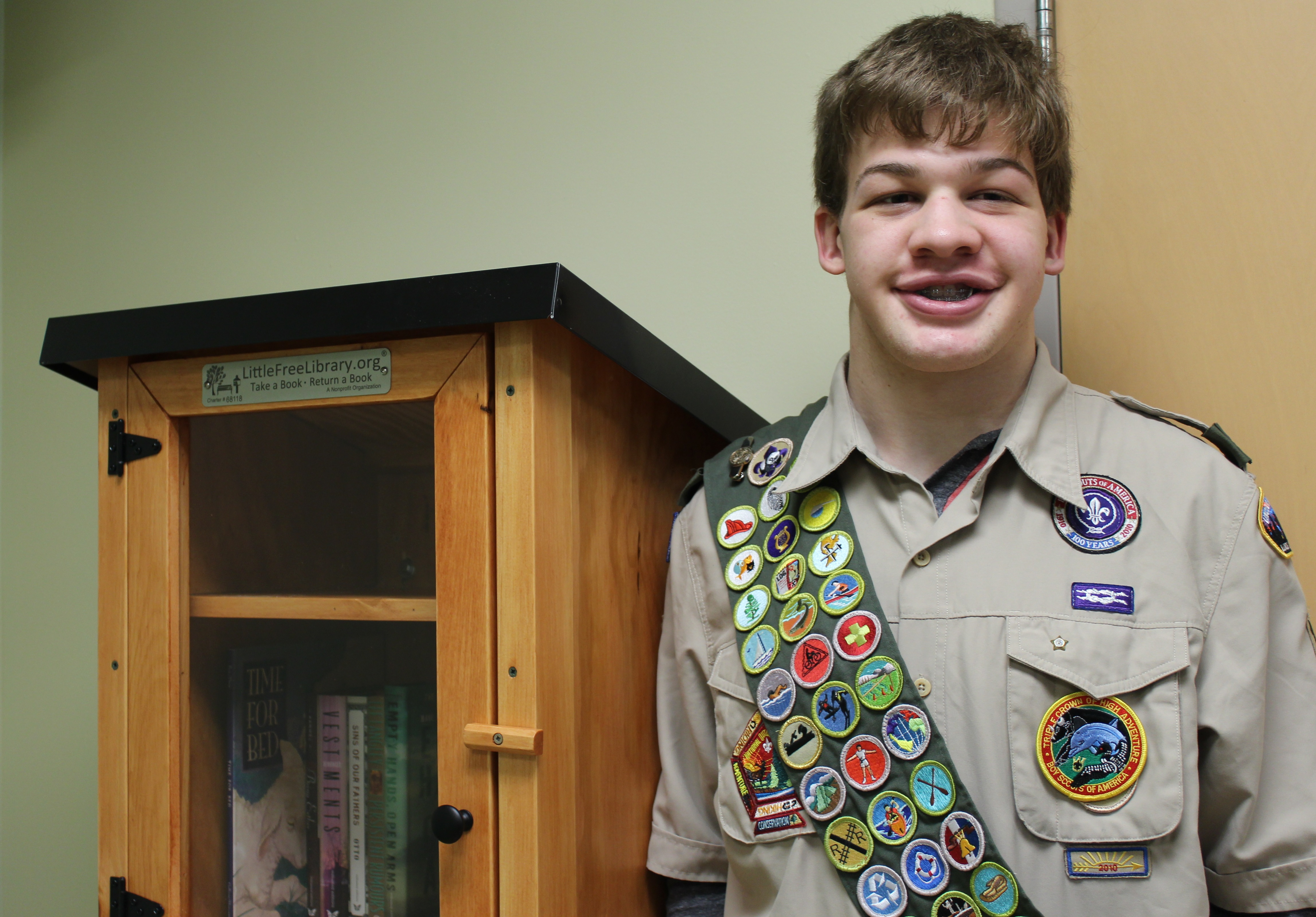 Michael Siebert donated two Little Free Libraries to waiting rooms at UofL Hospital as part of an Eagle Scout project.