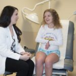 University of Louisville medical student Katherine Yared with patient Whitney Foster at Lee Specialty Clinic