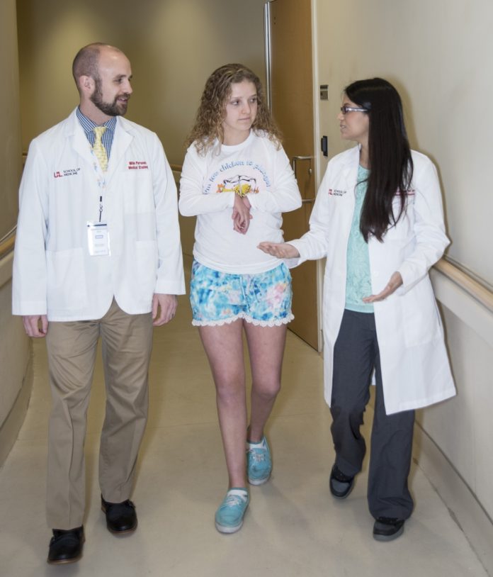 UofL medical student Michael Parsons, Lee Specialty Clinic patient Whitney Foster and Priya Chandan, M.D., M.P.H.