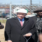 Interim president Greg Postel speaks during Passport Health Plan's groundbreaking ceremony. UofL will lease space in the new building in west Louisville.