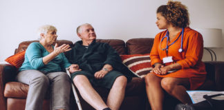 Older adults talking with a health care provider.