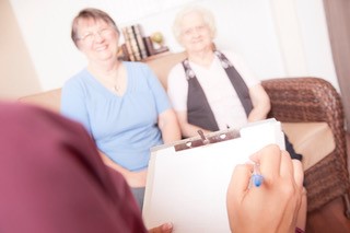 Older adults taking part in a discussion.
