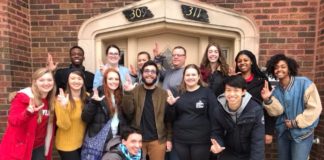 Alternative Service Break trip participants pose in front of Sarah's Inn in Chicago