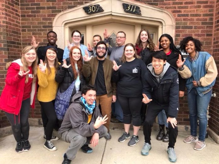 Alternative Service Break trip participants pose in front of Sarah's Inn in Chicago