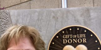 Donna Edwards, whose son Mike became an organ donor at age 25 after he died from an accident at work, is shown Friday in front of the new The Gift of Life Donor Memorial at University of Louisville Hospital after its unveiling.