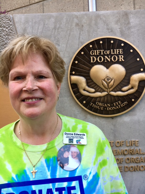 Donna Edwards, whose son Mike became an organ donor at age 25 after he died from an accident at work, is shown Friday in front of the new The Gift of Life Donor Memorial at University of Louisville Hospital after its unveiling.