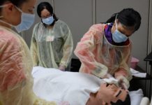 UofL Master's Entry into Professional Nursing students train in a clinical simulation.