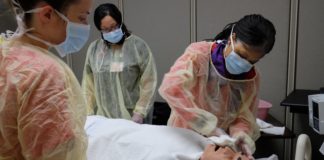 UofL Master's Entry into Professional Nursing students train in a clinical simulation.