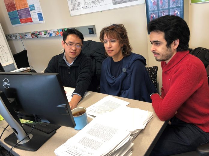 From Left: University of Louisville Ph.D. candidate Wenlong Sun, Dr. Olfa Nasraoui, and master student Sami Khenissi in the Knowledge Discovery and Web Mining Lab at the J.B. Speed School of Engineering.