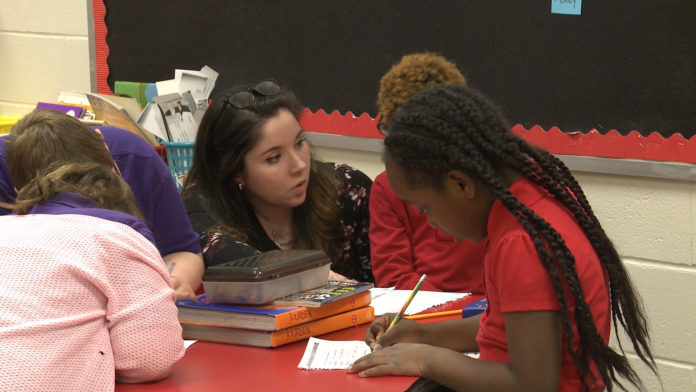 Sarah French, left, had to overcome quite a bit of adversity growing up. On May 12, she will graduate from the University of Louisville.