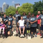 Todd Crawford, Center, with participants in the 5K to Cure Paralysis in 2015